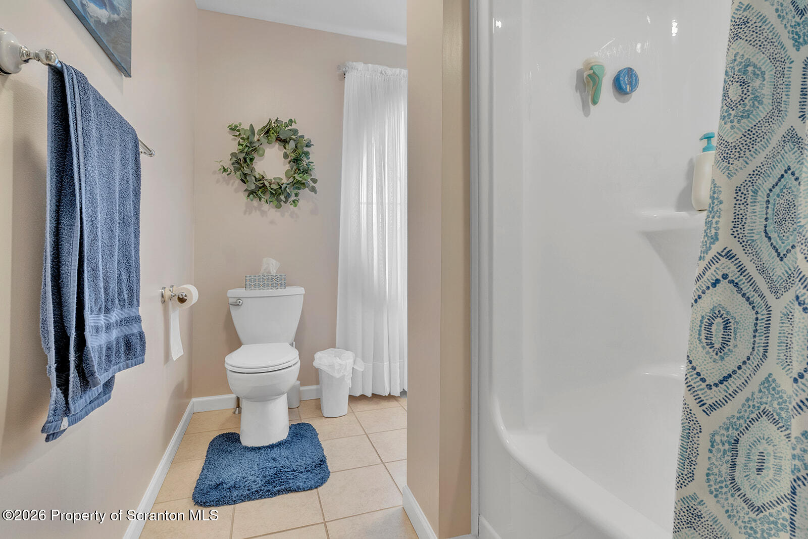 1611 Cherry Street Scranton, PA 18505 - Photo 69 of 86 a bathroom with a toilet and a shower curtain