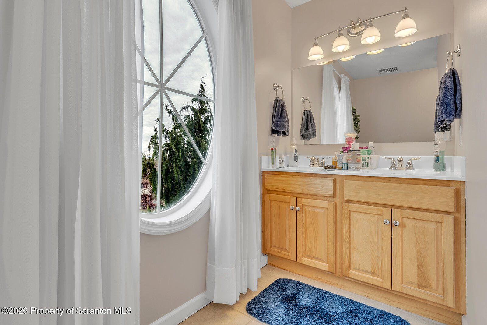 1611 Cherry Street Scranton, PA 18505 - Photo 70 of 86 a bathroom with a sink a light fixture and a mirror