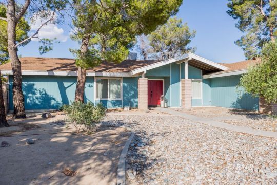 730 Scott Circle Ridgecrest, CA 93555 - Photo 3 of 32 a front view of a house with garden