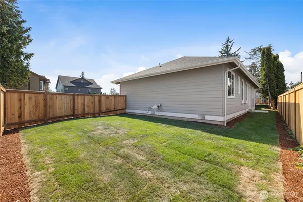 a backyard of a house with lots of green space
