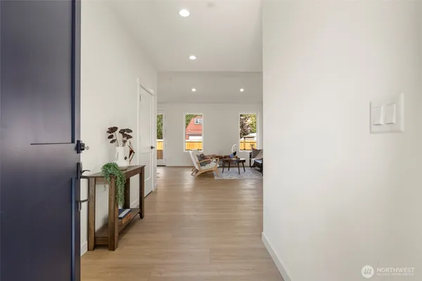 a view of living room with furniture and wooden floor