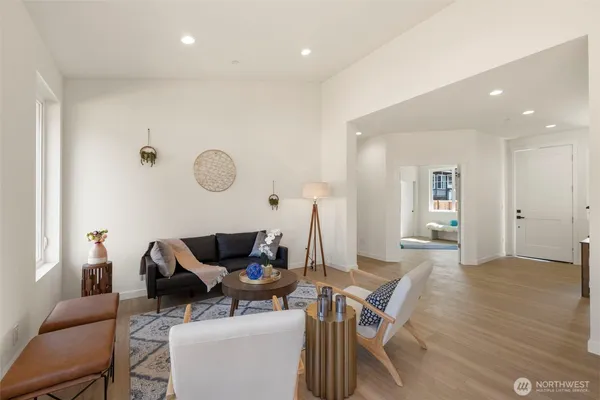 a work room with furniture and wooden floor