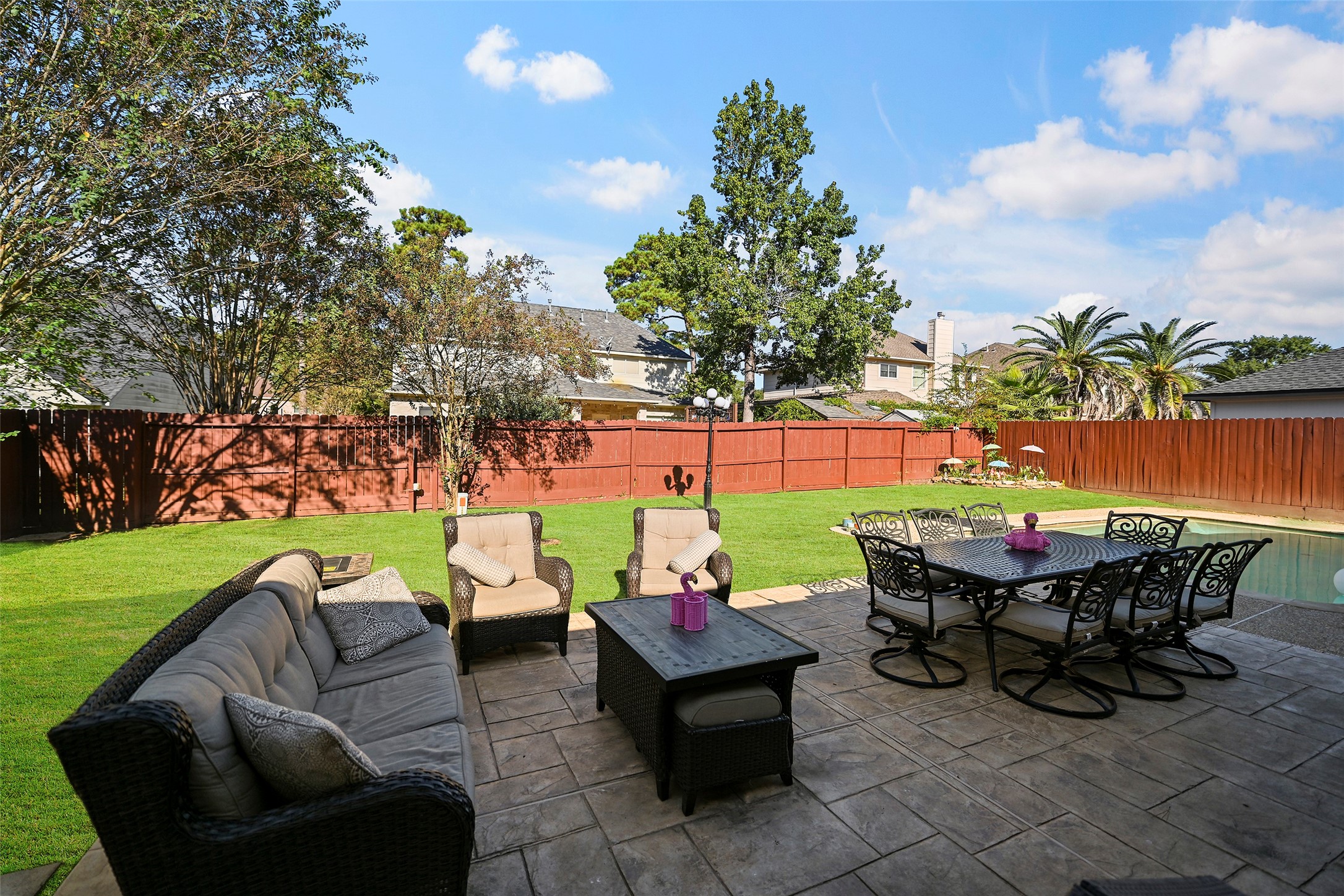 25119 Aughton Drive Spring, TX 77389 - Photo 15 of 41 a view of a patio with couches table and chairs and potted plants