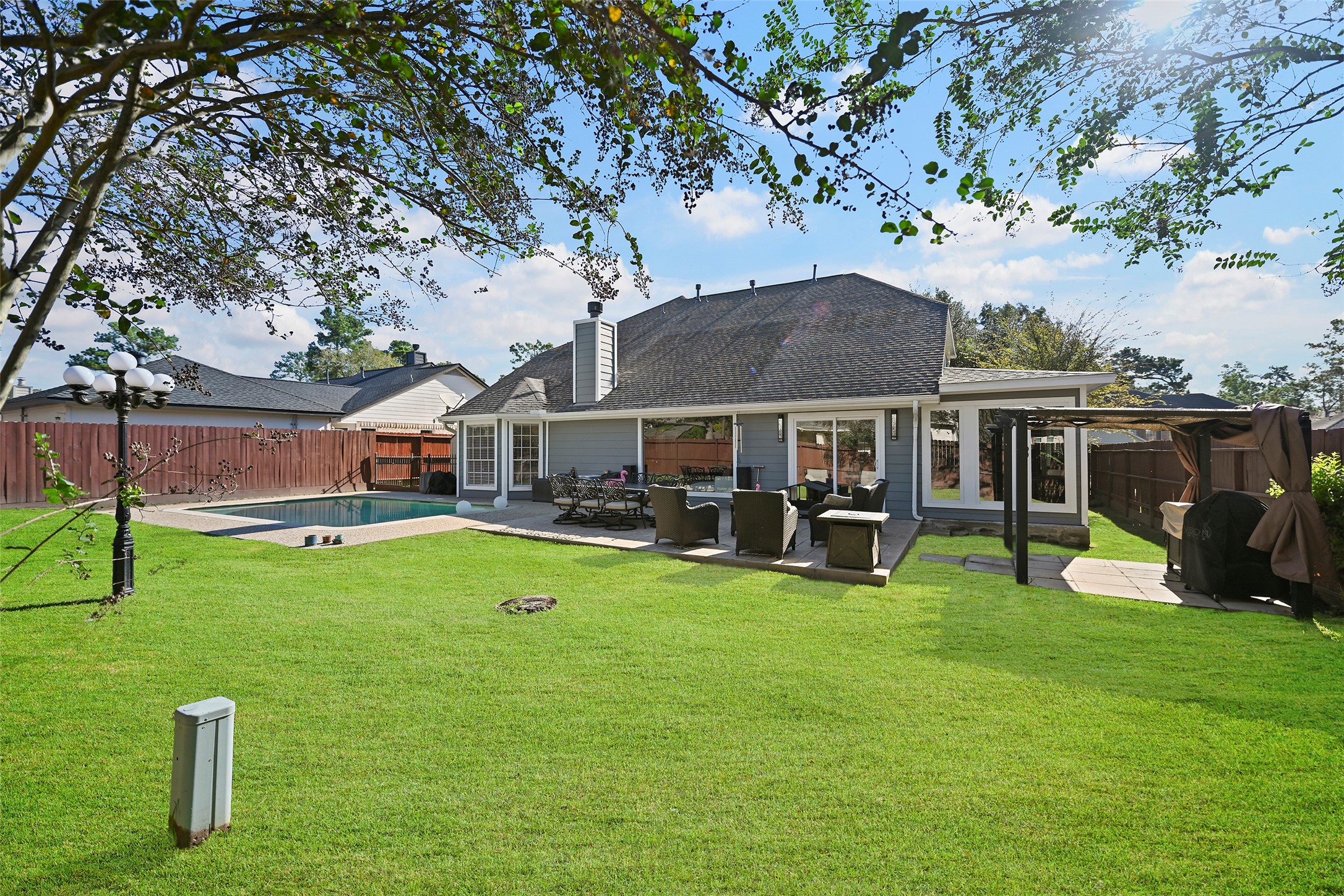 25119 Aughton Drive Spring, TX 77389 - Photo 17 of 41 a view of a house with backyard porch and sitting area