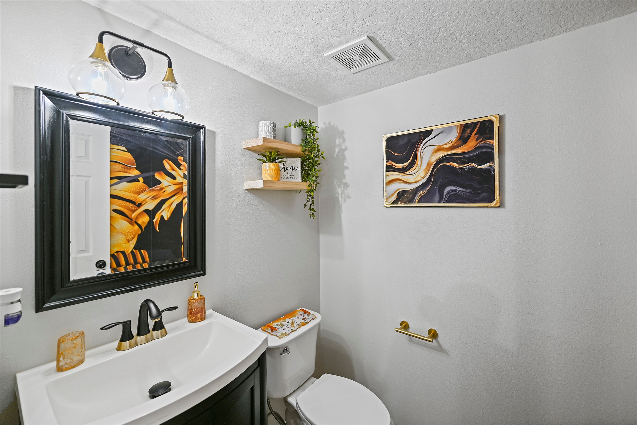 25119 Aughton Drive Spring, TX 77389 - Photo 20 of 41 a bathroom with a sink mirror and toilet