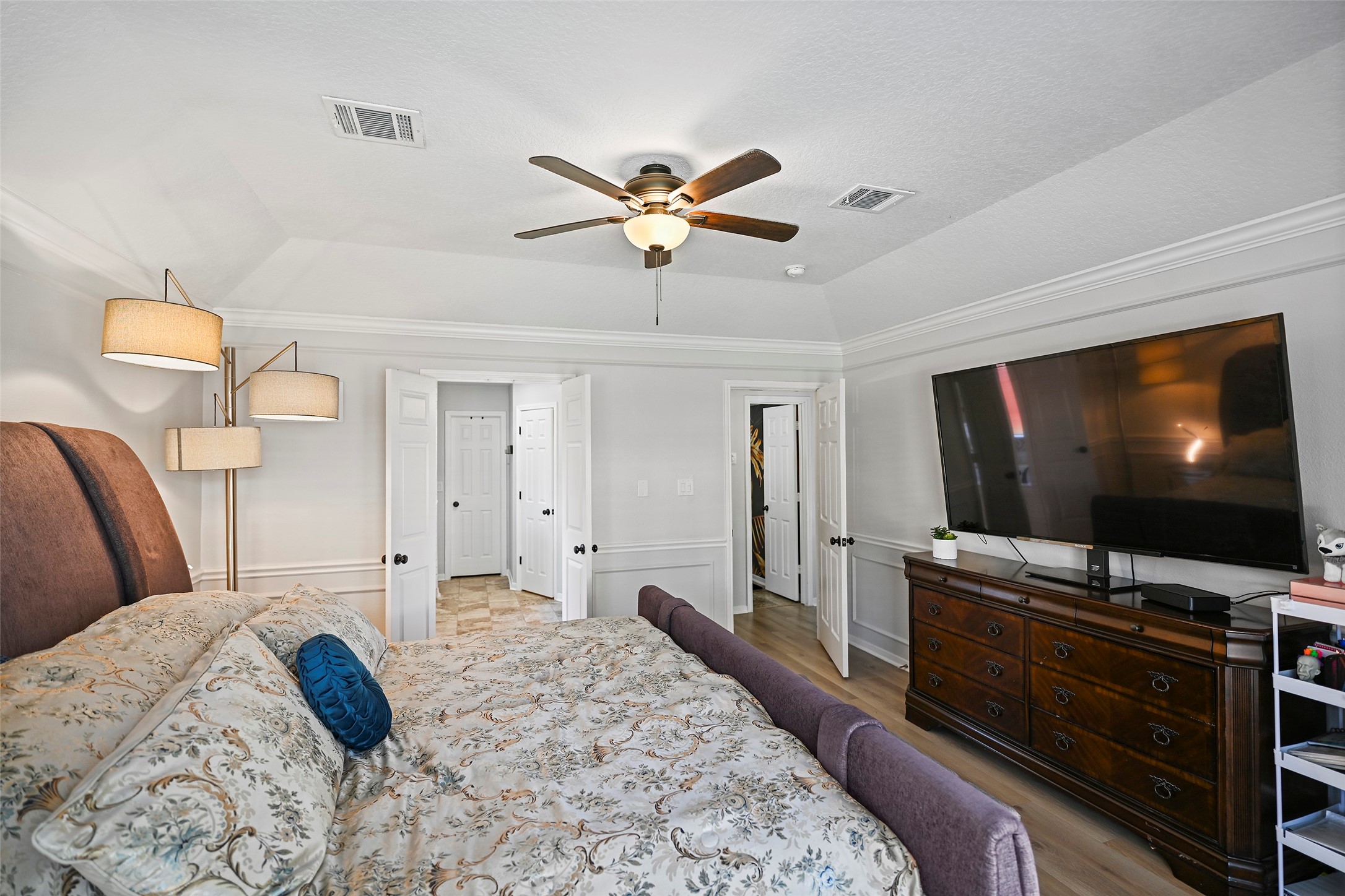 25119 Aughton Drive Spring, TX 77389 - Photo 22 of 41 a bedroom with a bed and a flat screen tv
