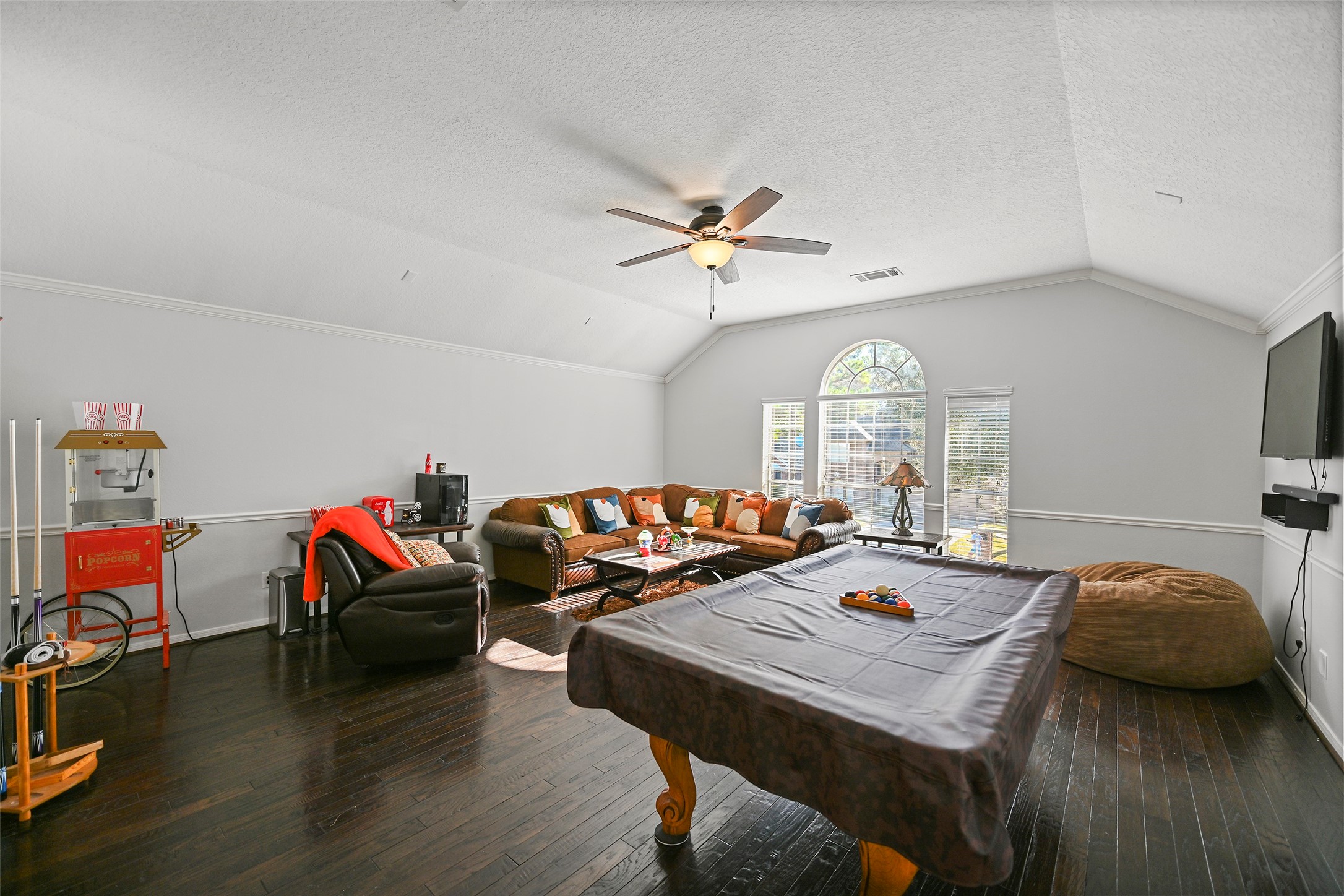 25119 Aughton Drive Spring, TX 77389 - Photo 26 of 41 a bedroom with a bed and a chandelier