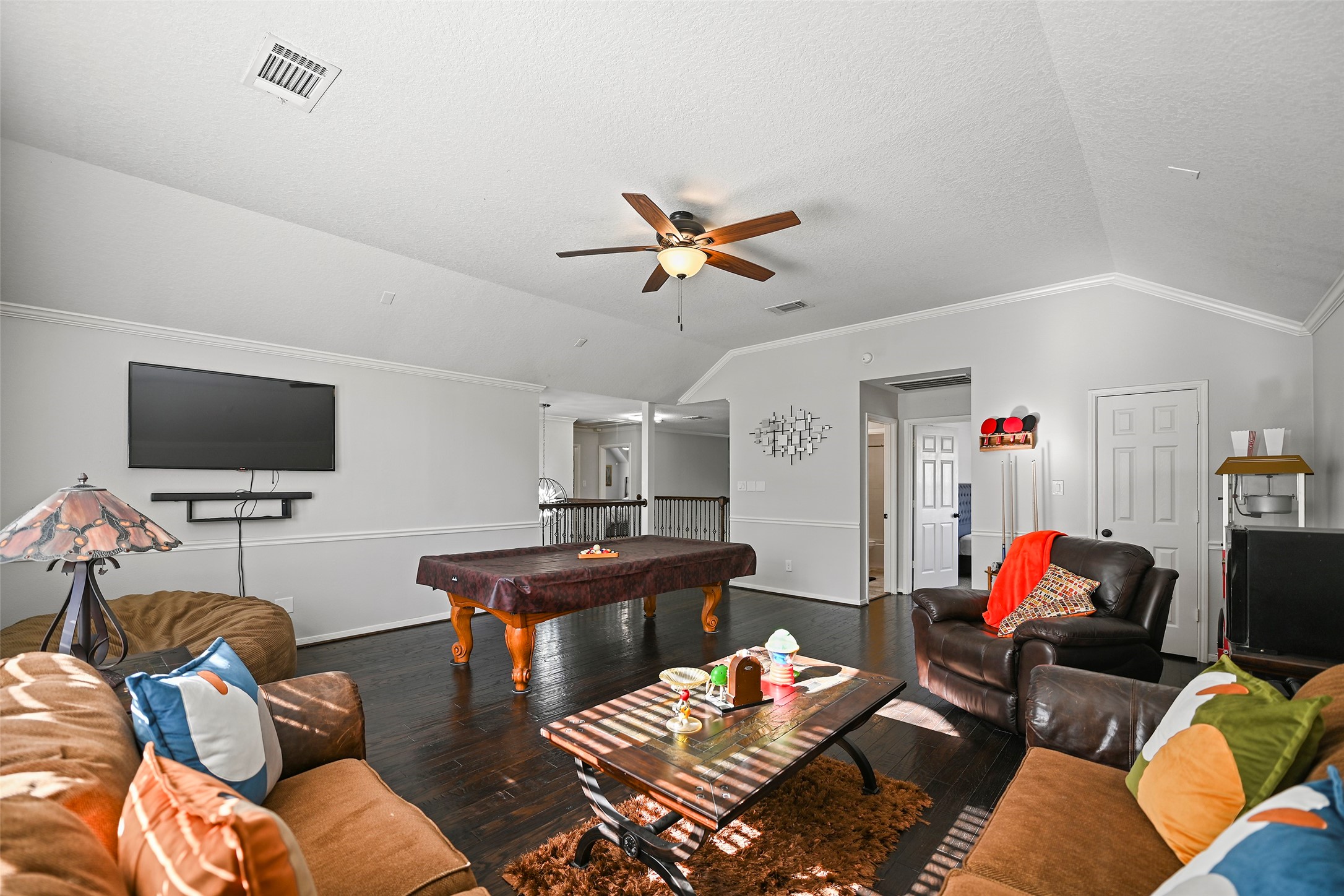 25119 Aughton Drive Spring, TX 77389 - Photo 27 of 41 a living room with furniture and a flat screen tv