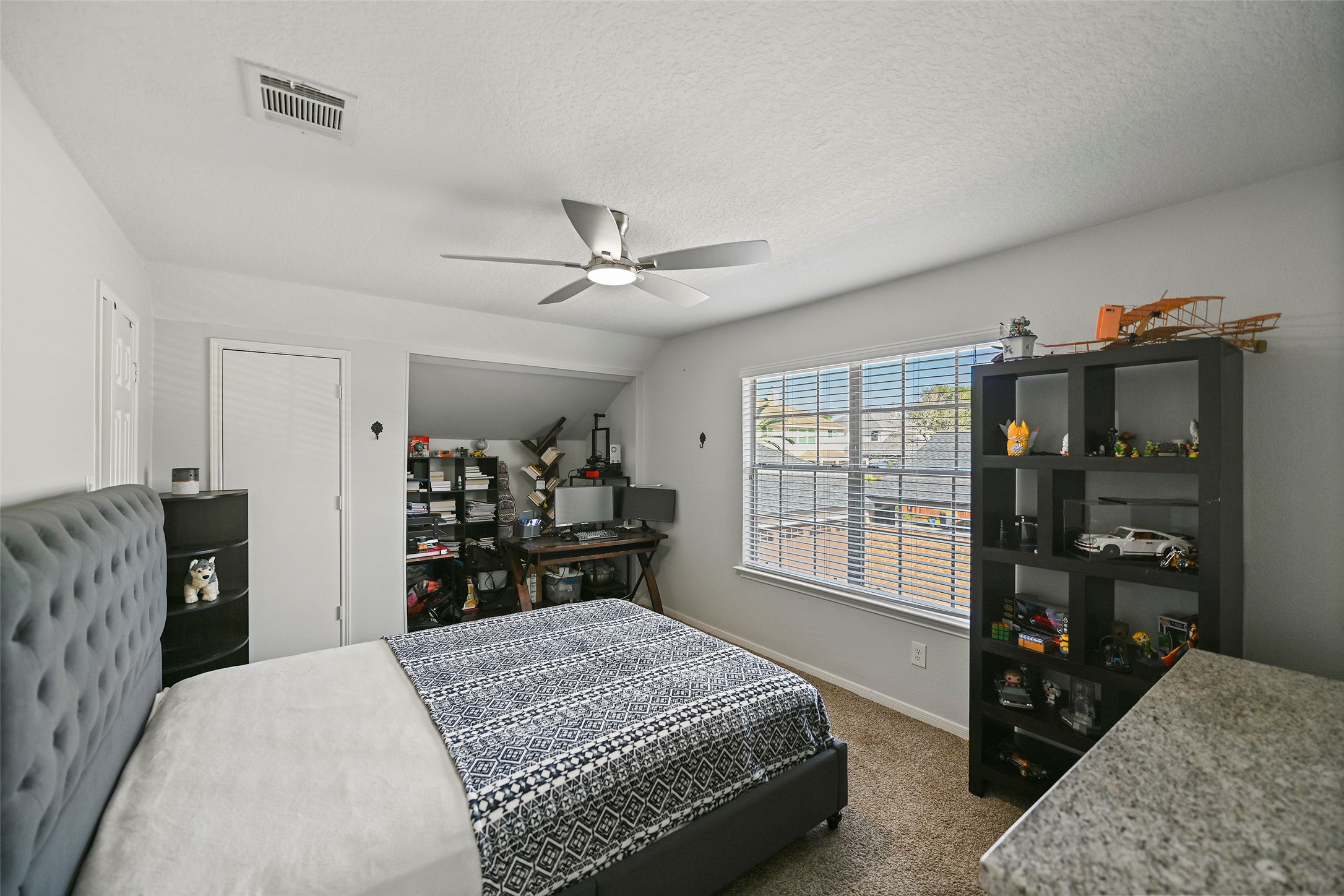 25119 Aughton Drive Spring, TX 77389 - Photo 28 of 41 a bed room with a bed window and a television
