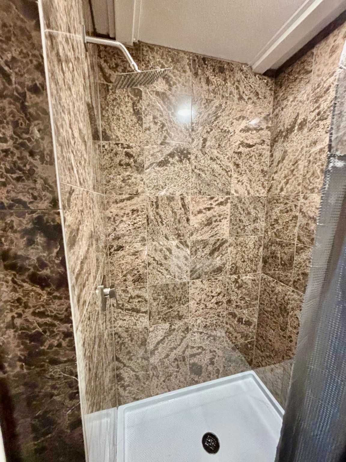 25119 Aughton Drive Spring, TX 77389 - Photo 32 of 41 a bathroom with a shower curtain and a sink