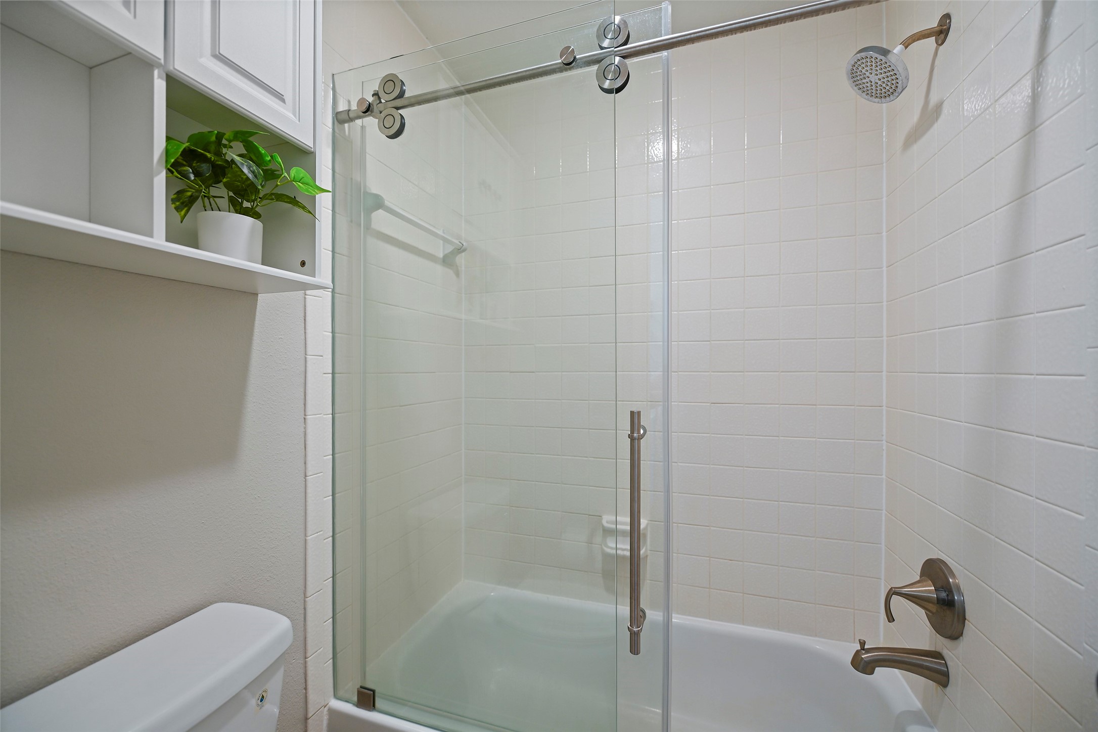25119 Aughton Drive Spring, TX 77389 - Photo 34 of 41 a bathroom with a shower and a toilet