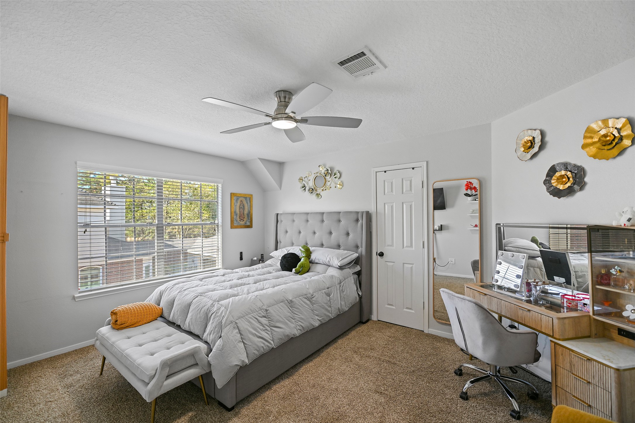 25119 Aughton Drive Spring, TX 77389 - Photo 36 of 41 a bedroom with a bed and a chandelier