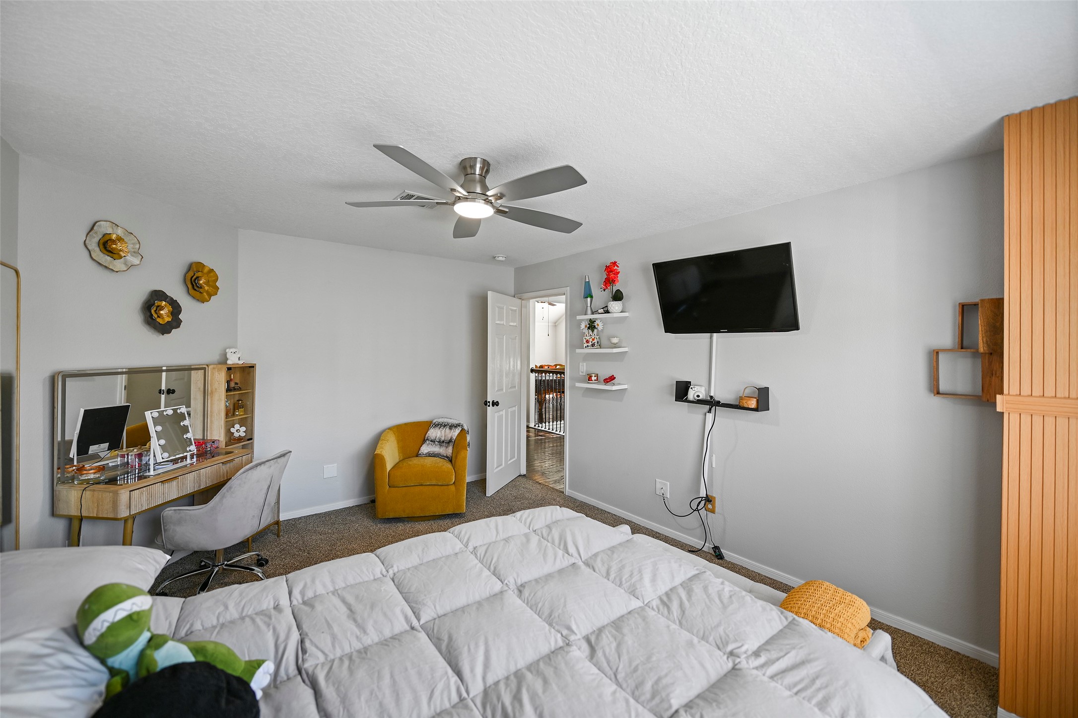 25119 Aughton Drive Spring, TX 77389 - Photo 37 of 41 a bedroom with a bed and a flat screen tv