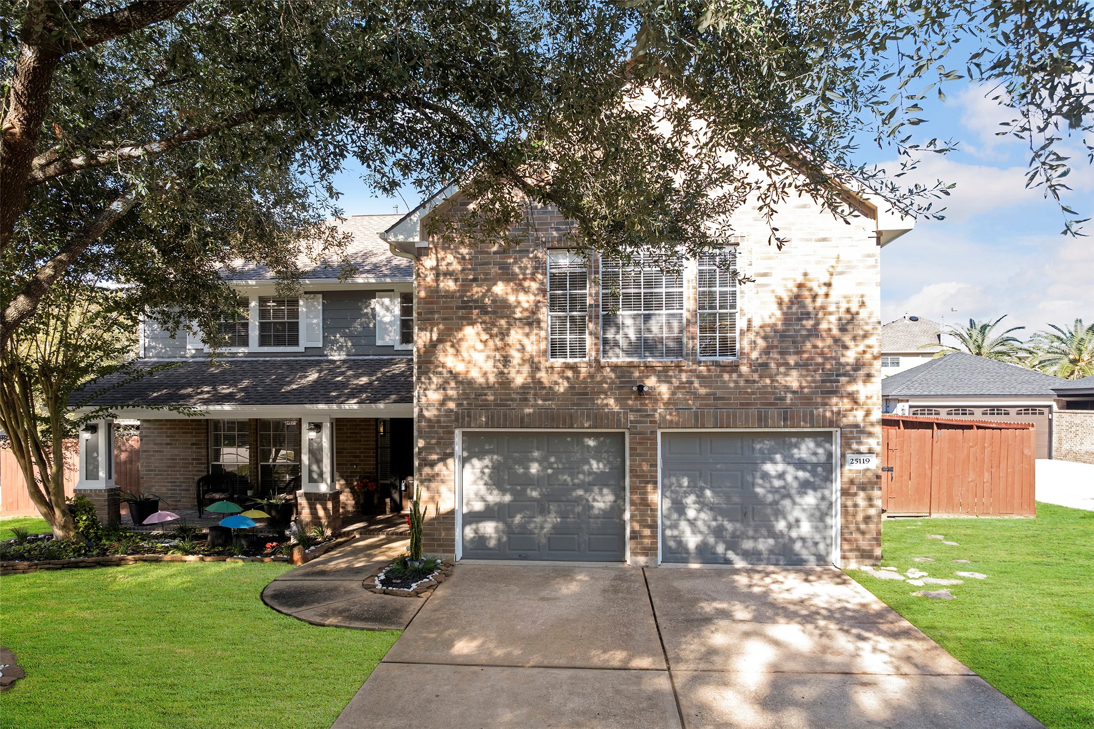 25119 Aughton Drive Spring, TX 77389 - Photo 41 of 41 a front view of a house with a yard and a garage