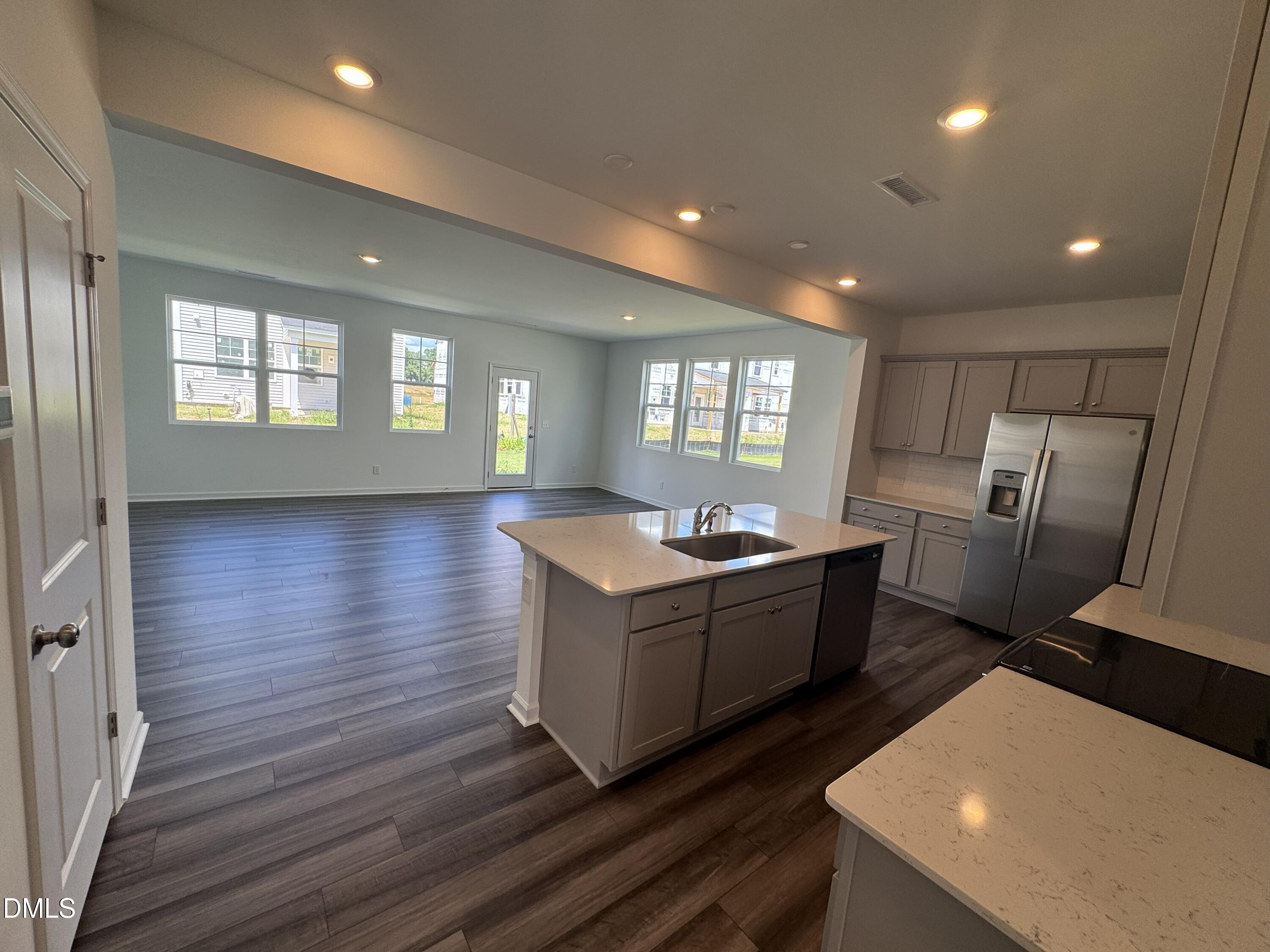 359 Thompson Overlook Way Smithfield, NC 27577 - Photo 2 of 42 a large room with lots of counter space and windows