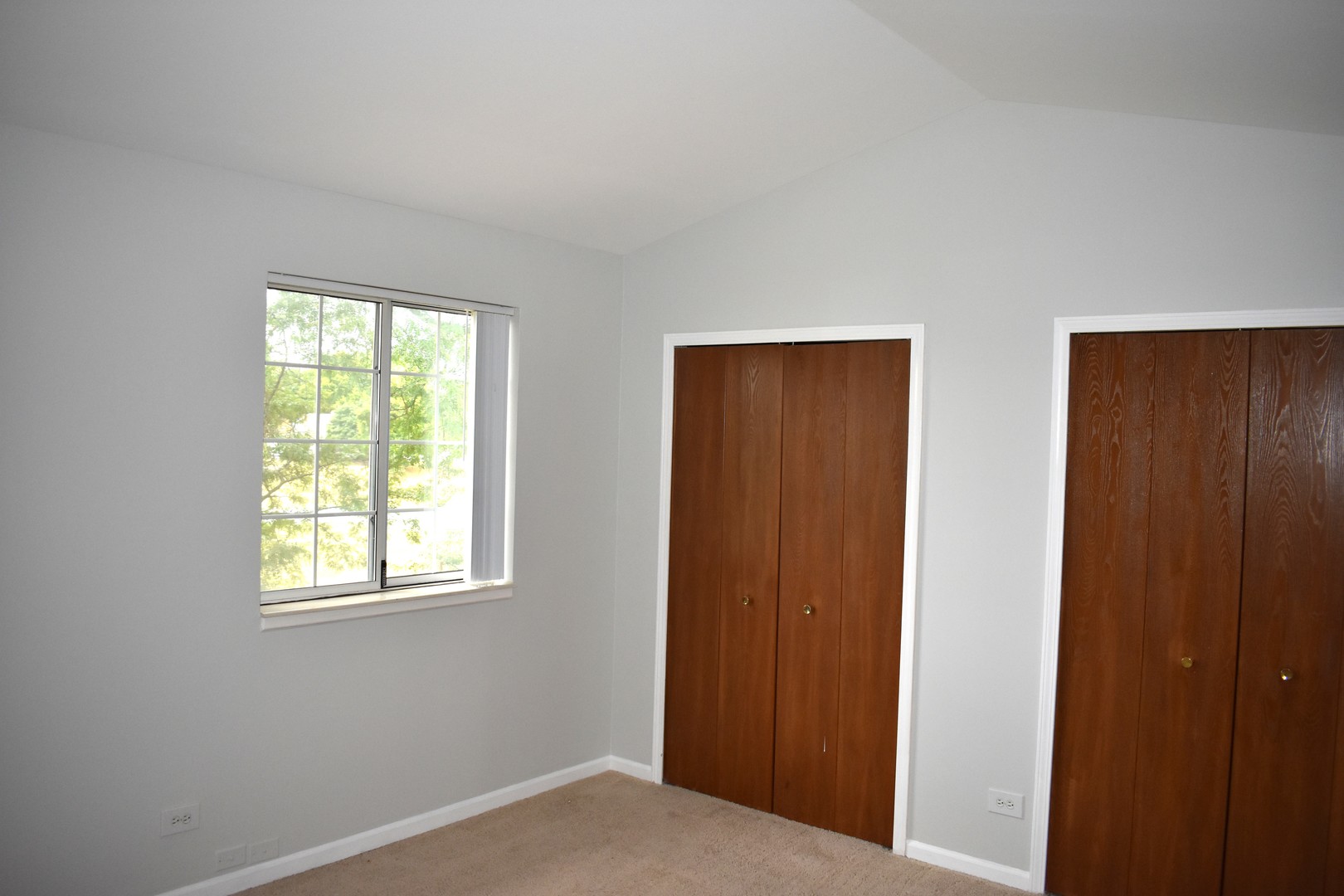 1344 South Lorraine Road, Unit F Wheaton, IL 60189 - Photo 15 of 27 a view of a room that has a window in it