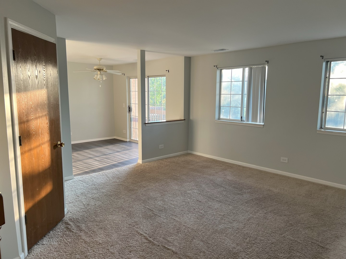 1344 South Lorraine Road, Unit F Wheaton, IL 60189 - Photo 4 of 27 a view of an empty room with window and closet area