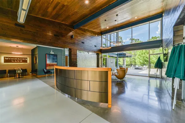 a gym area with wooden floor and outdoor space