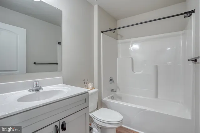 a bathroom with a sink toilet tub and shower