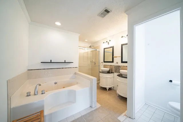 a bathroom with a bathtub and a sink