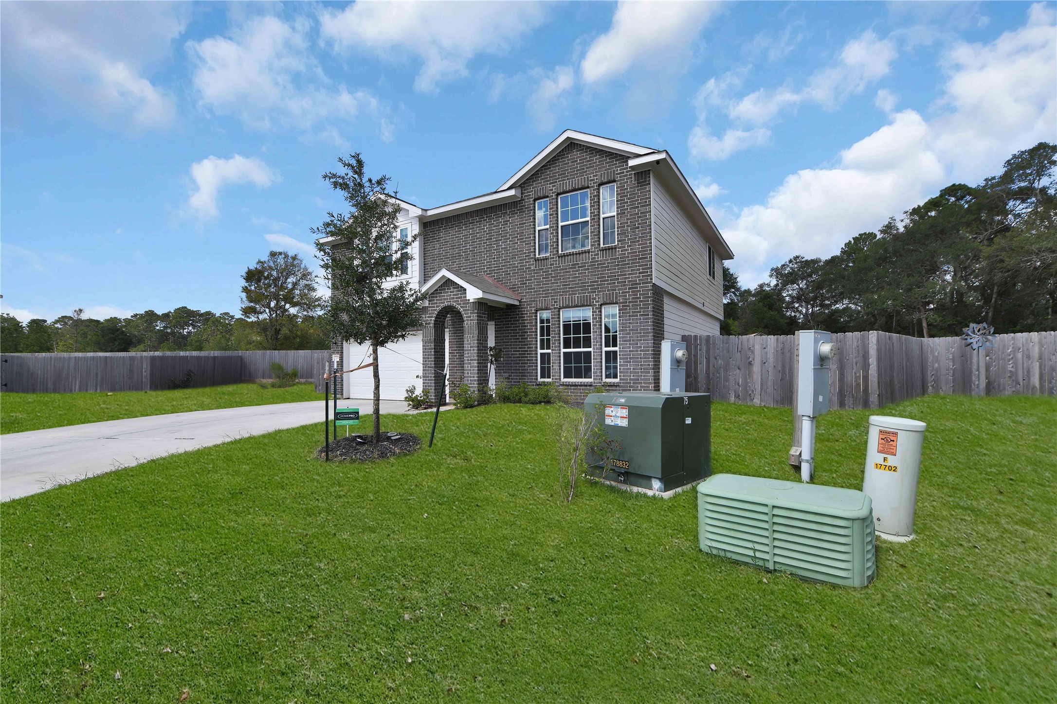 17703 Lion Heart Road Conroe, TX 77306 - Photo 3 of 26 a garden view with a seating space