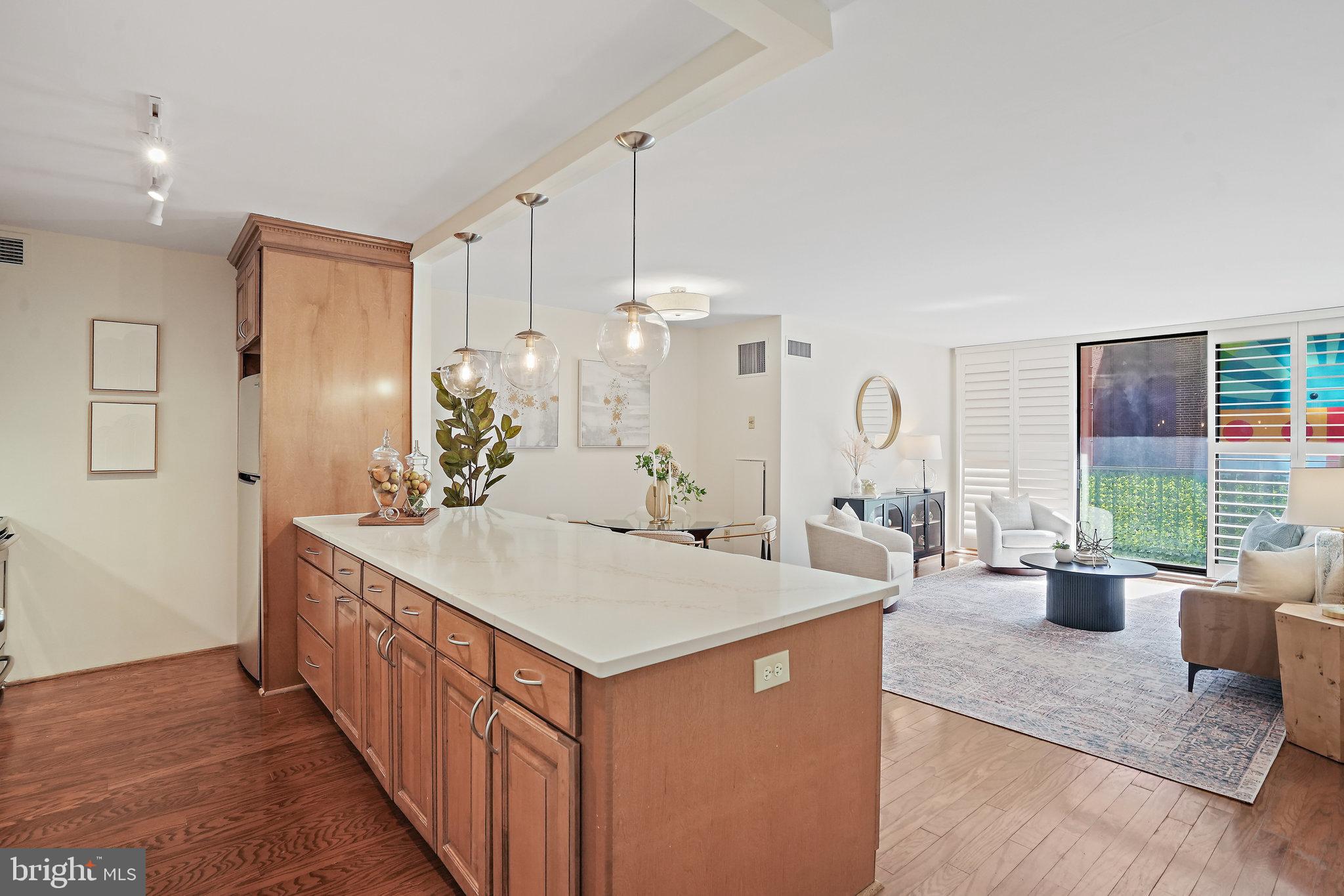 a large white kitchen with a large window