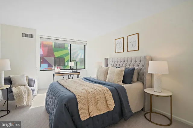 a bedroom with a bed and window