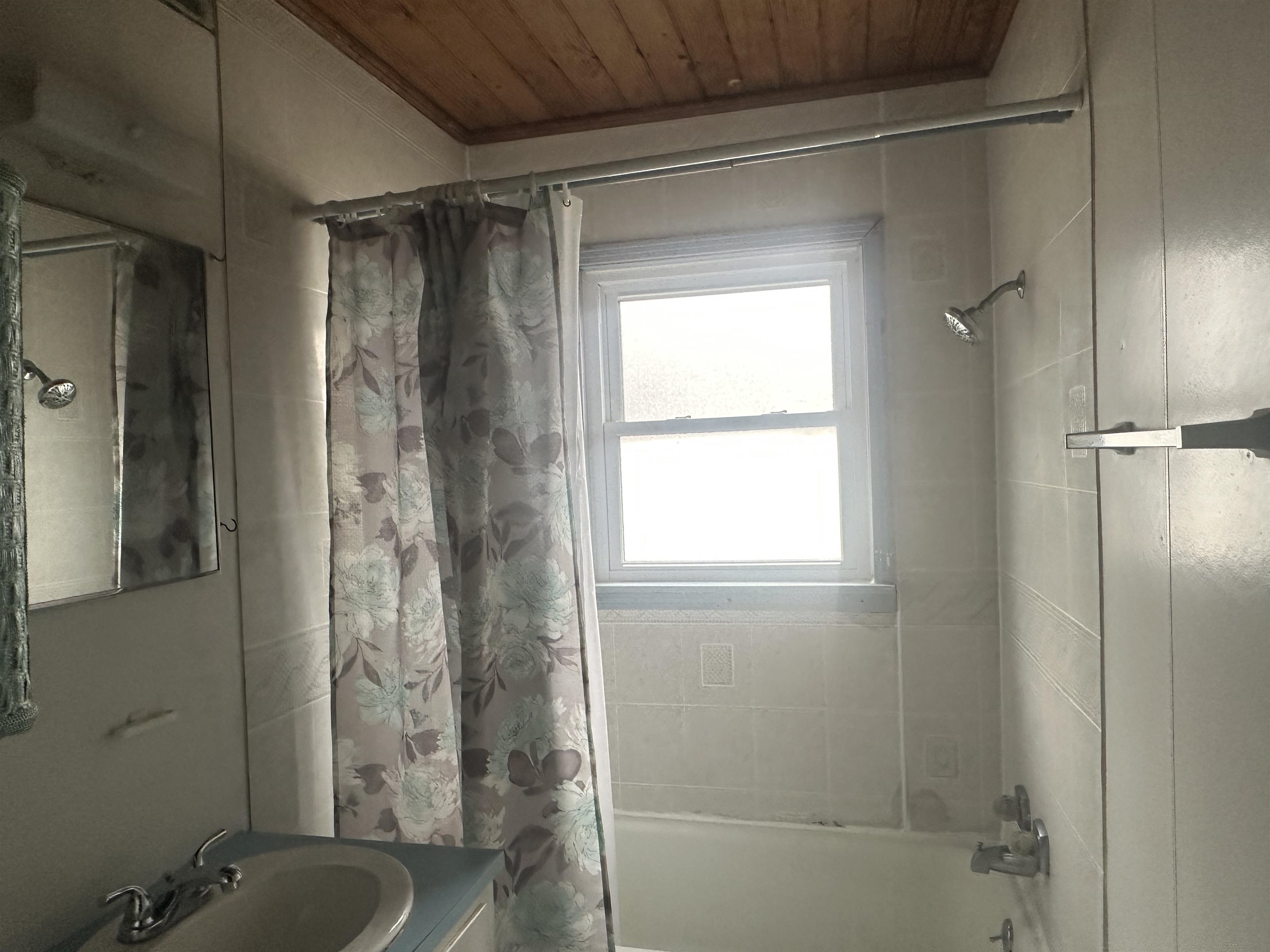 123 North Magnolia Street Adamsville, TN 38310 - Photo 22 of 25 a bathroom with a shower and a sink