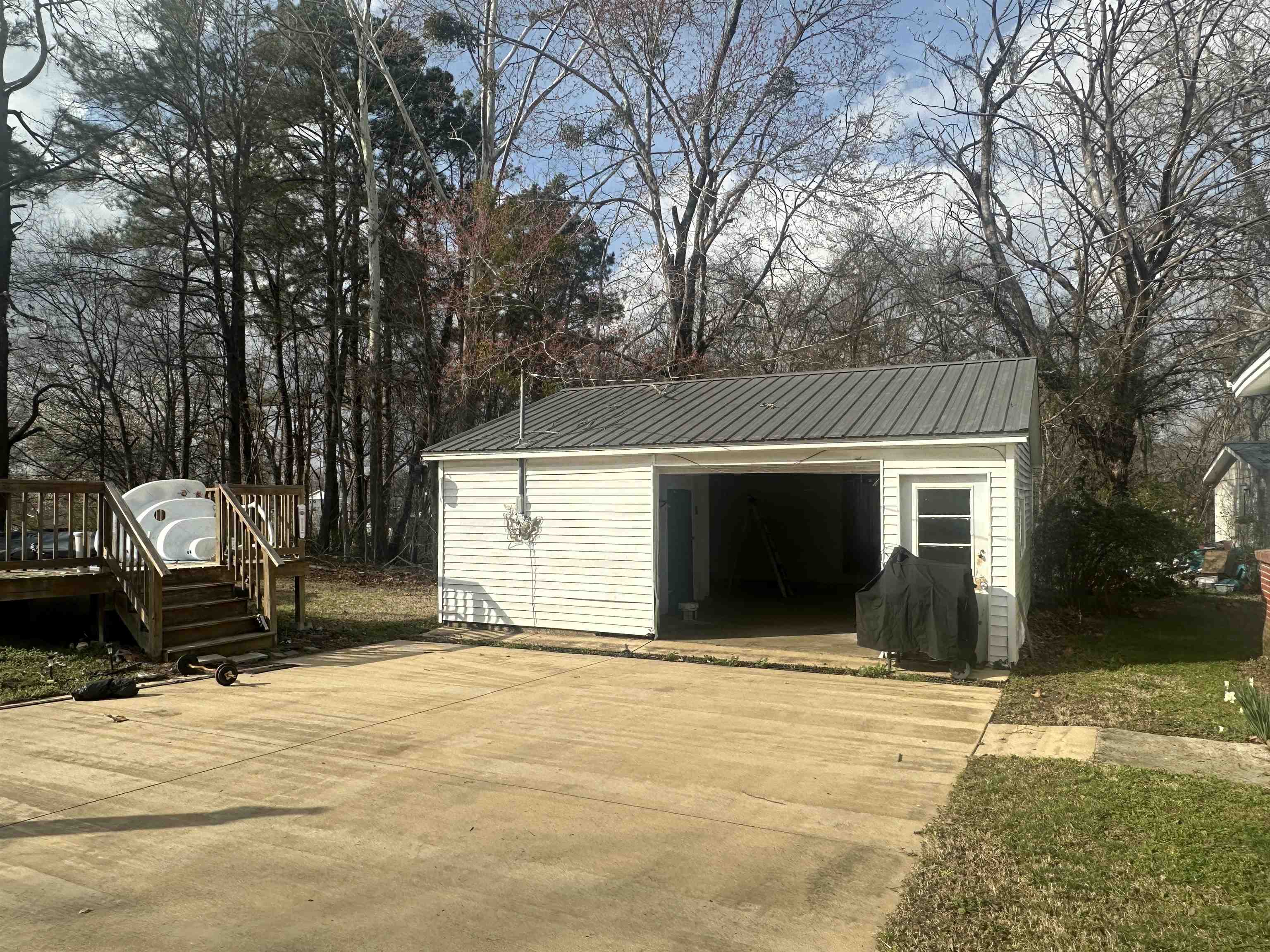 123 North Magnolia Street Adamsville, TN 38310 - Photo 5 of 25 a front view of a house with a yard