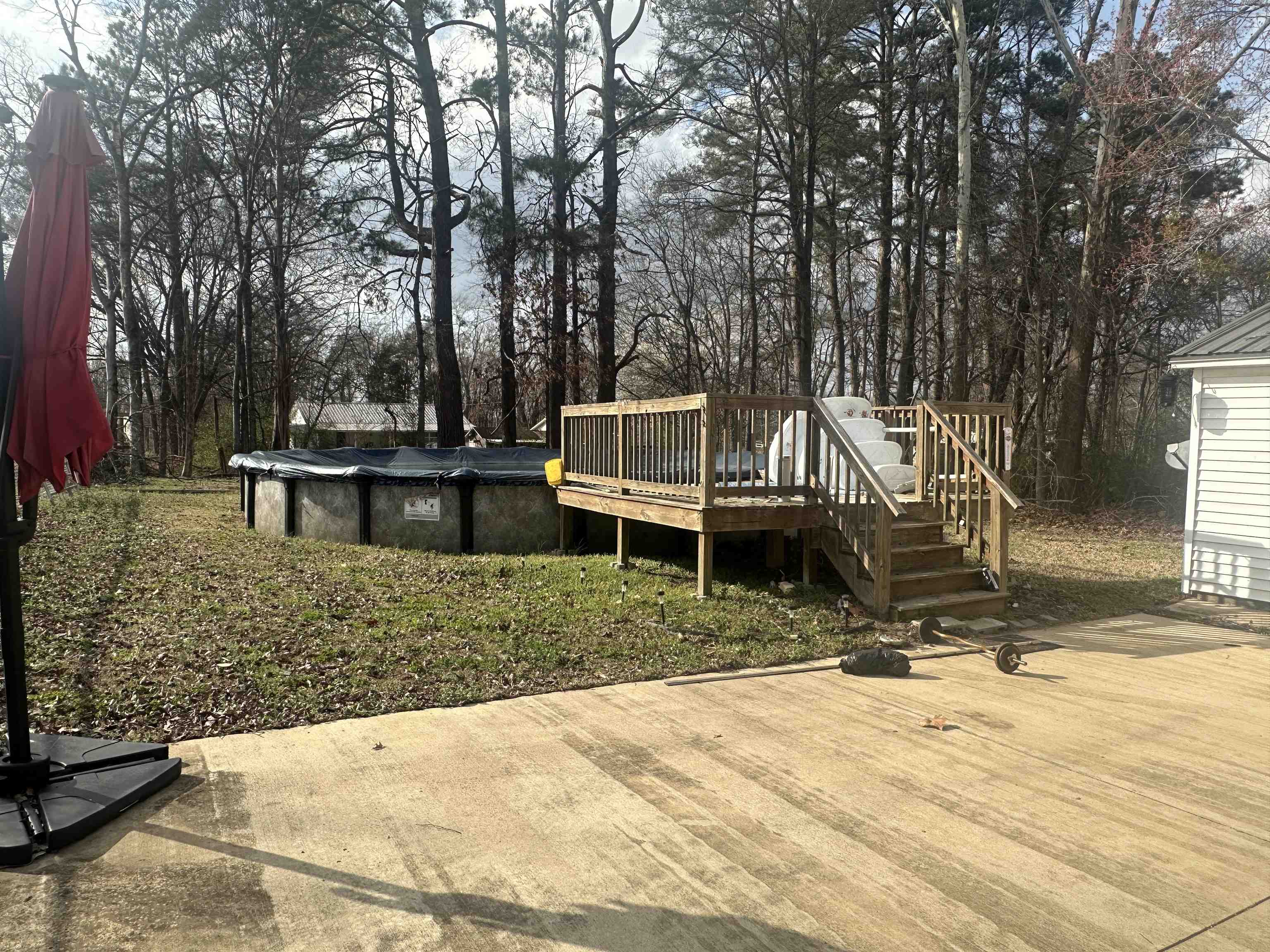 123 North Magnolia Street Adamsville, TN 38310 - Photo 6 of 25 a view of a house with backyard and trees