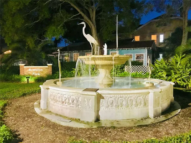 a view of a golf course with a lake view