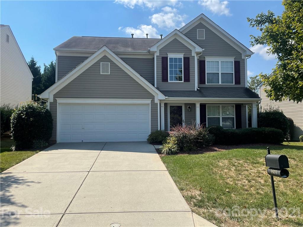 3503 Burnage Hall Road Harrisburg, NC 28075 - Photo 1 of 1 a front view of a house with garden