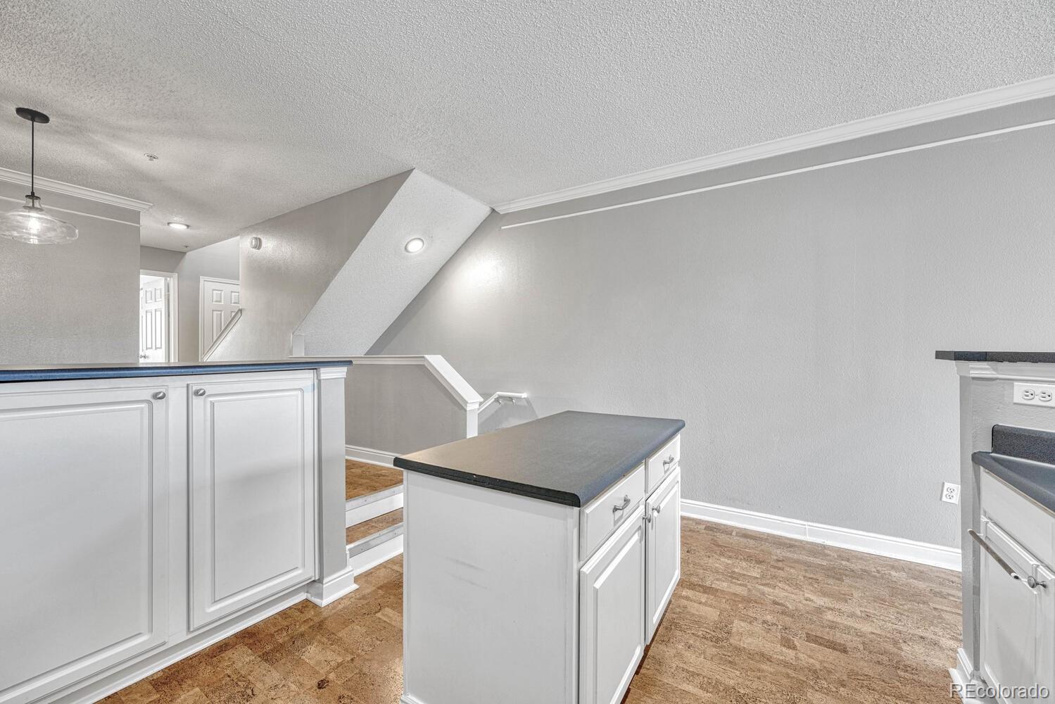 2149 Eagle Avenue Superior, CO 80027 - Photo 12 of 31 a kitchen with granite countertop a refrigerator and a sink