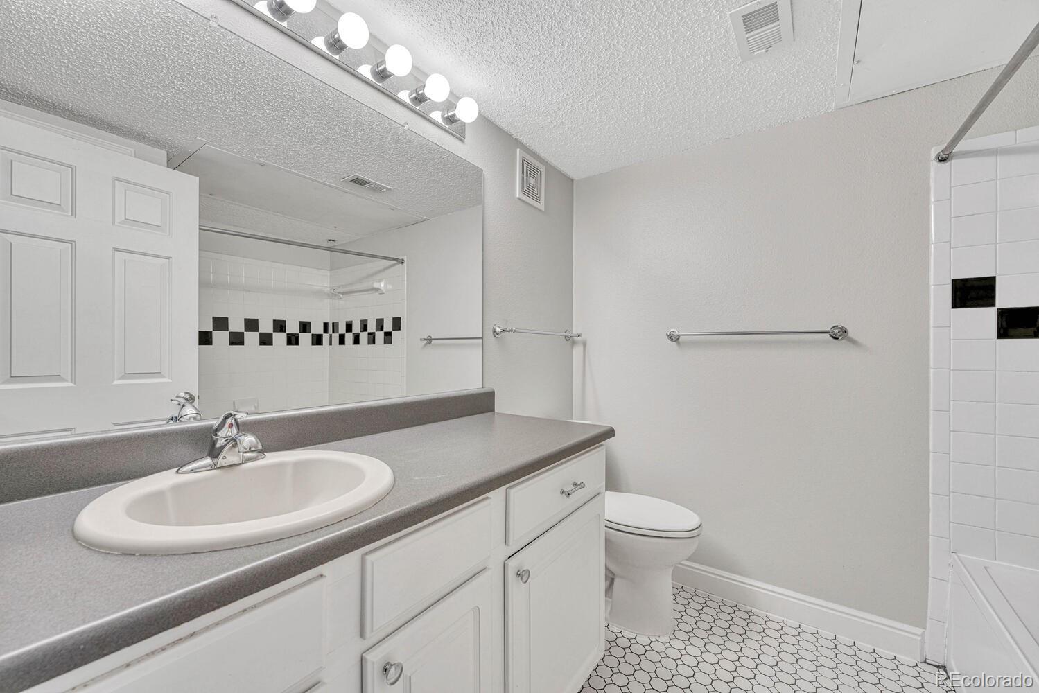2149 Eagle Avenue Superior, CO 80027 - Photo 15 of 31 a bathroom with a sink a toilet and a mirror