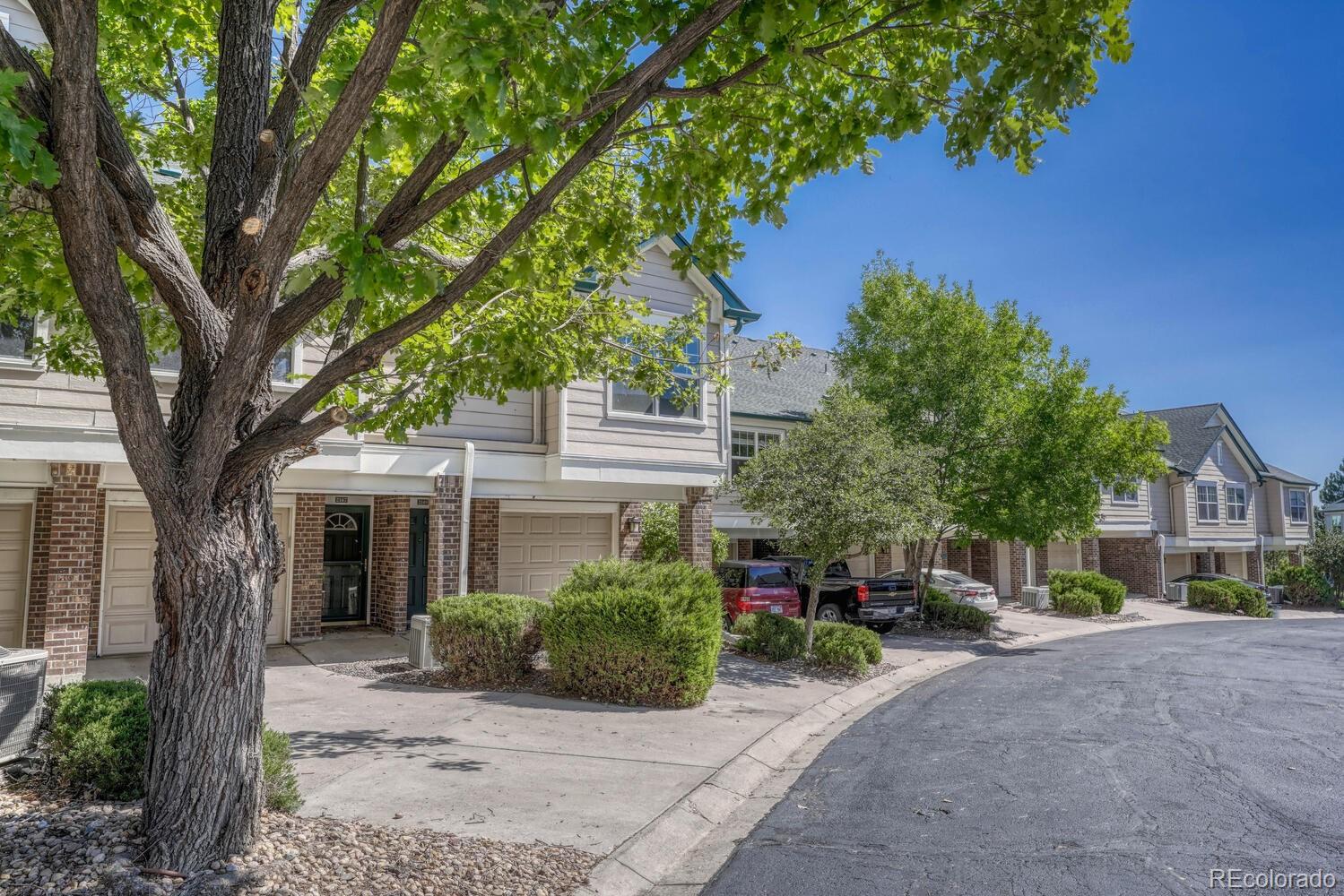 2149 Eagle Avenue Superior, CO 80027 - Photo 29 of 31 a view of a white house with a large tree and next to a yard