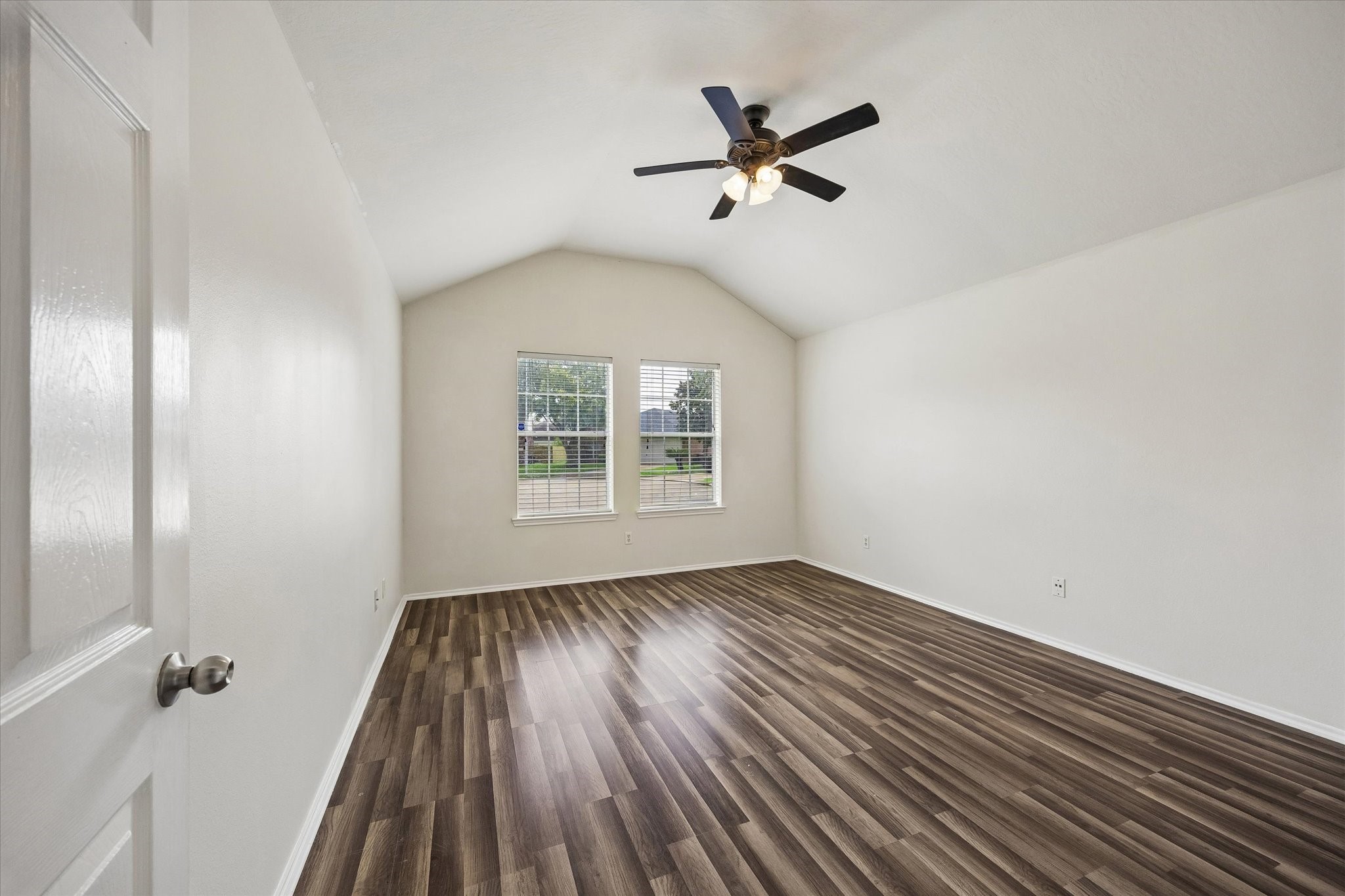 2614 Balsam Ridge Way Fresno, TX 77545 - Photo 7 of 14 wooden floor in an empty room with a window