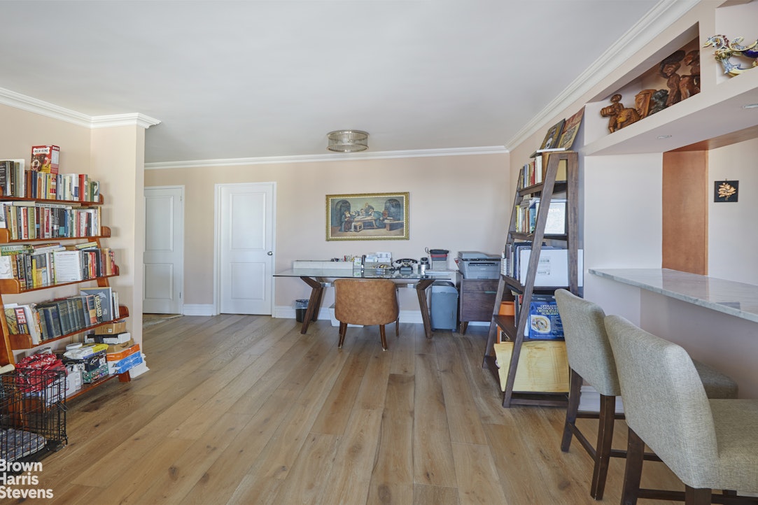 460 East 79th Street, Unit 16A Manhattan, NY 10075 - Photo 16 of 20 a view of a workspace with furniture and toys