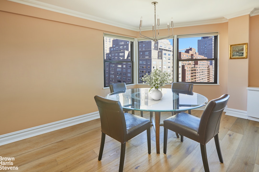 460 East 79th Street, Unit 16A Manhattan, NY 10075 - Photo 17 of 20 a view of a dining room with furniture window and outside view