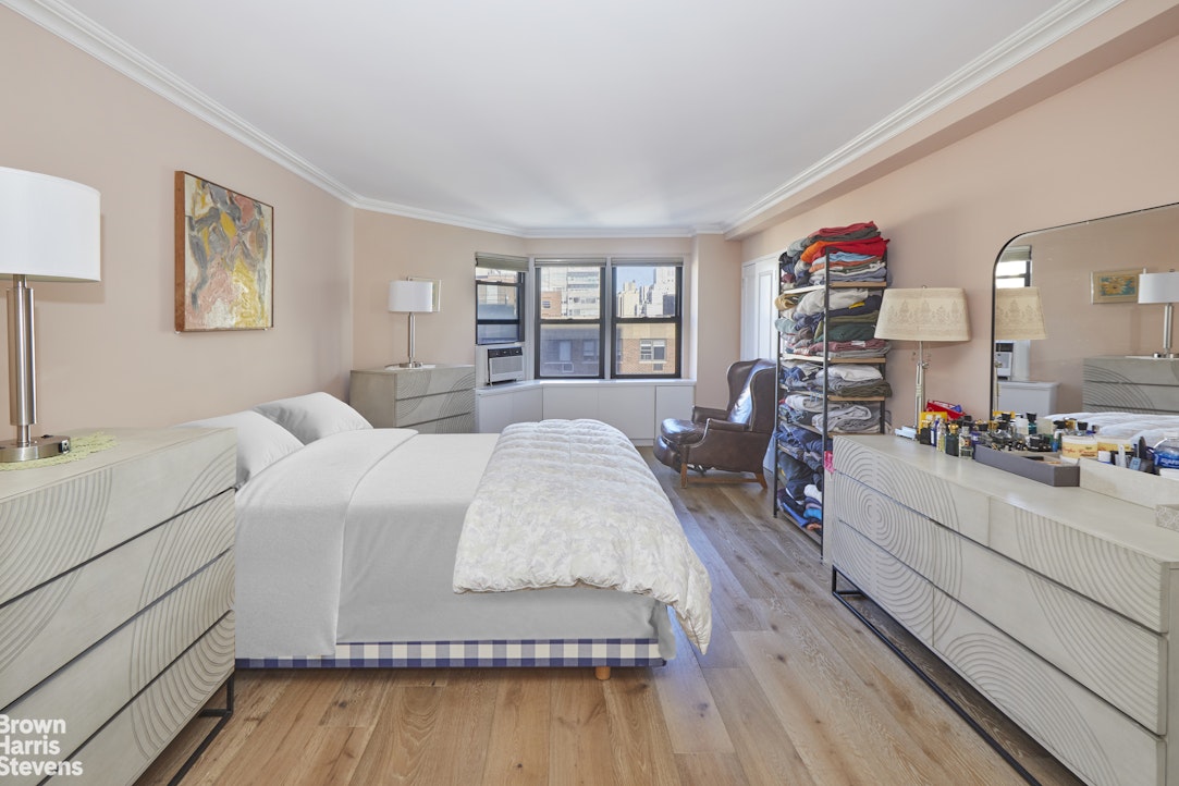 460 East 79th Street, Unit 16A Manhattan, NY 10075 - Photo 9 of 20 a living room with furniture and a wooden floor