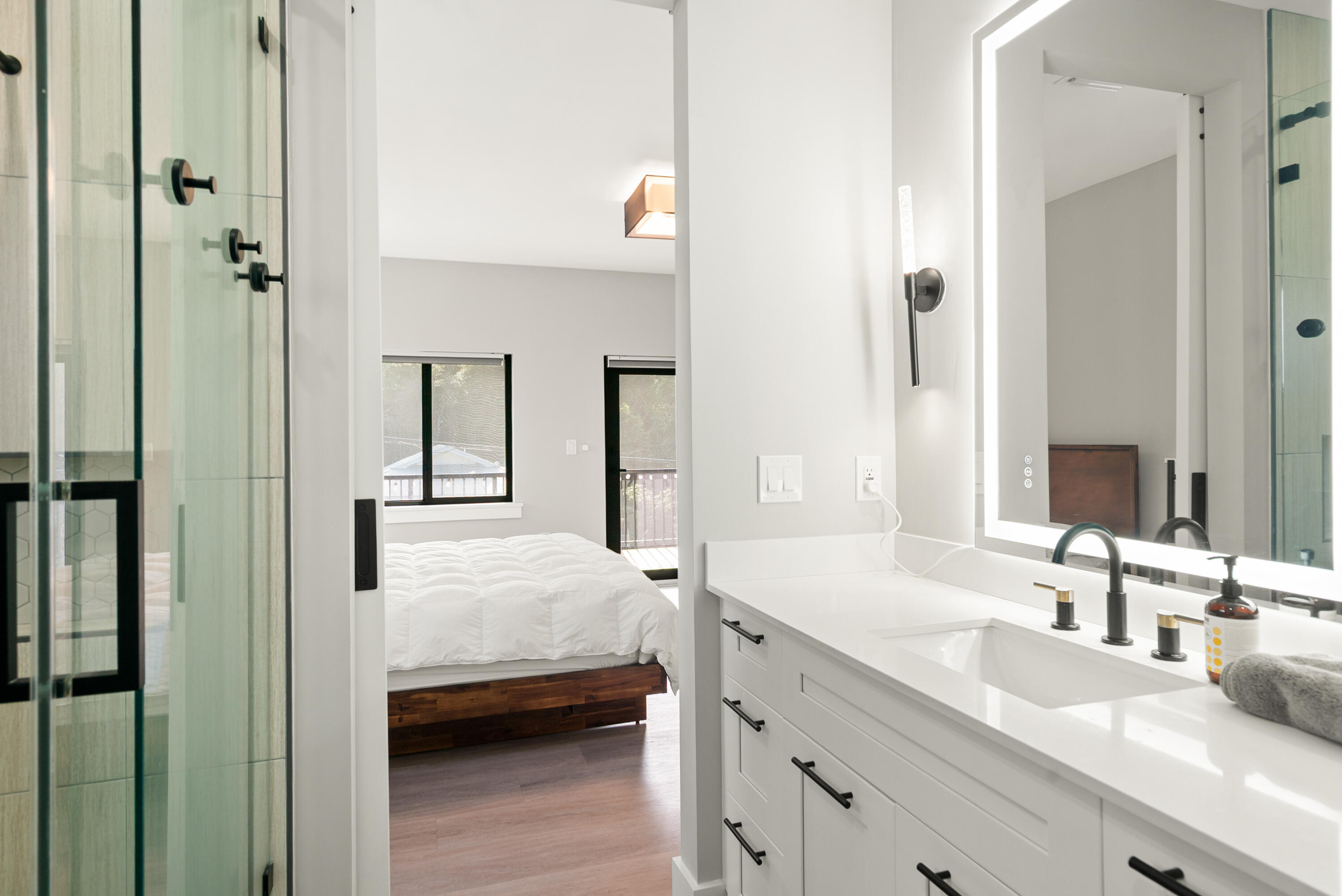 13 Coral Way Key Largo, FL 33037 - Photo 12 of 34 a en suite bathroom with a double vanity sink and mirror