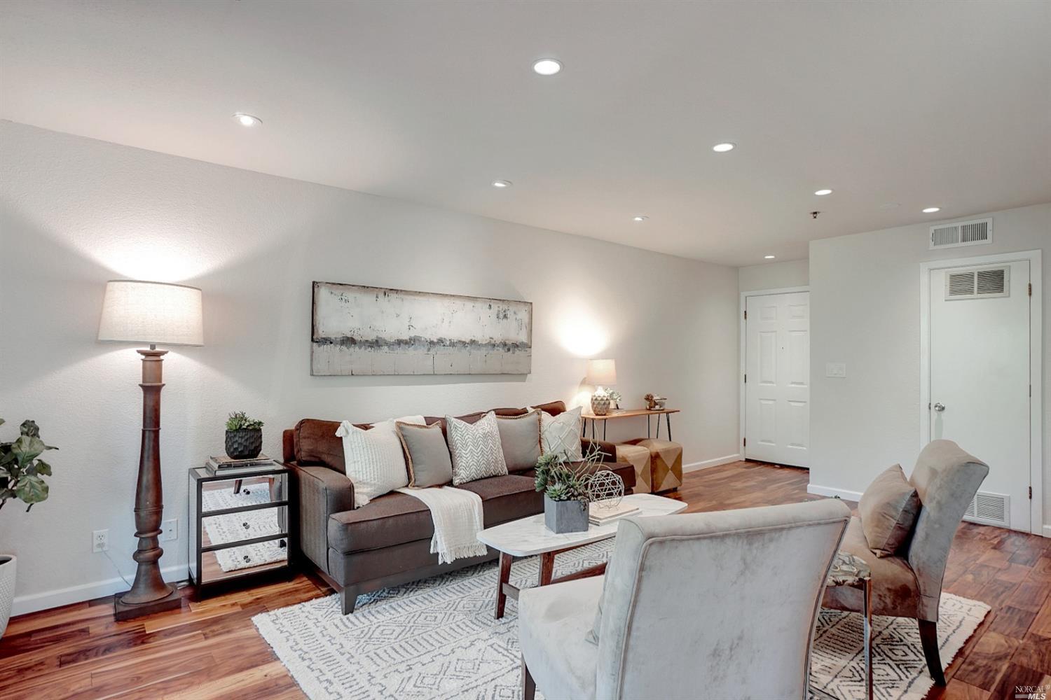 166 Pelican Lane Novato, CA 94949 - Photo 1 of 1 a living room with furniture and wooden floor