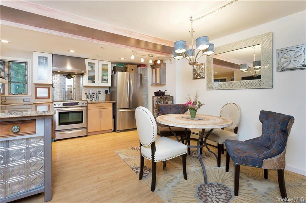 18-24 Valley Road Katonah, NY 10536 - Photo 1 of 1 a view of a dining room with furniture and wooden floor