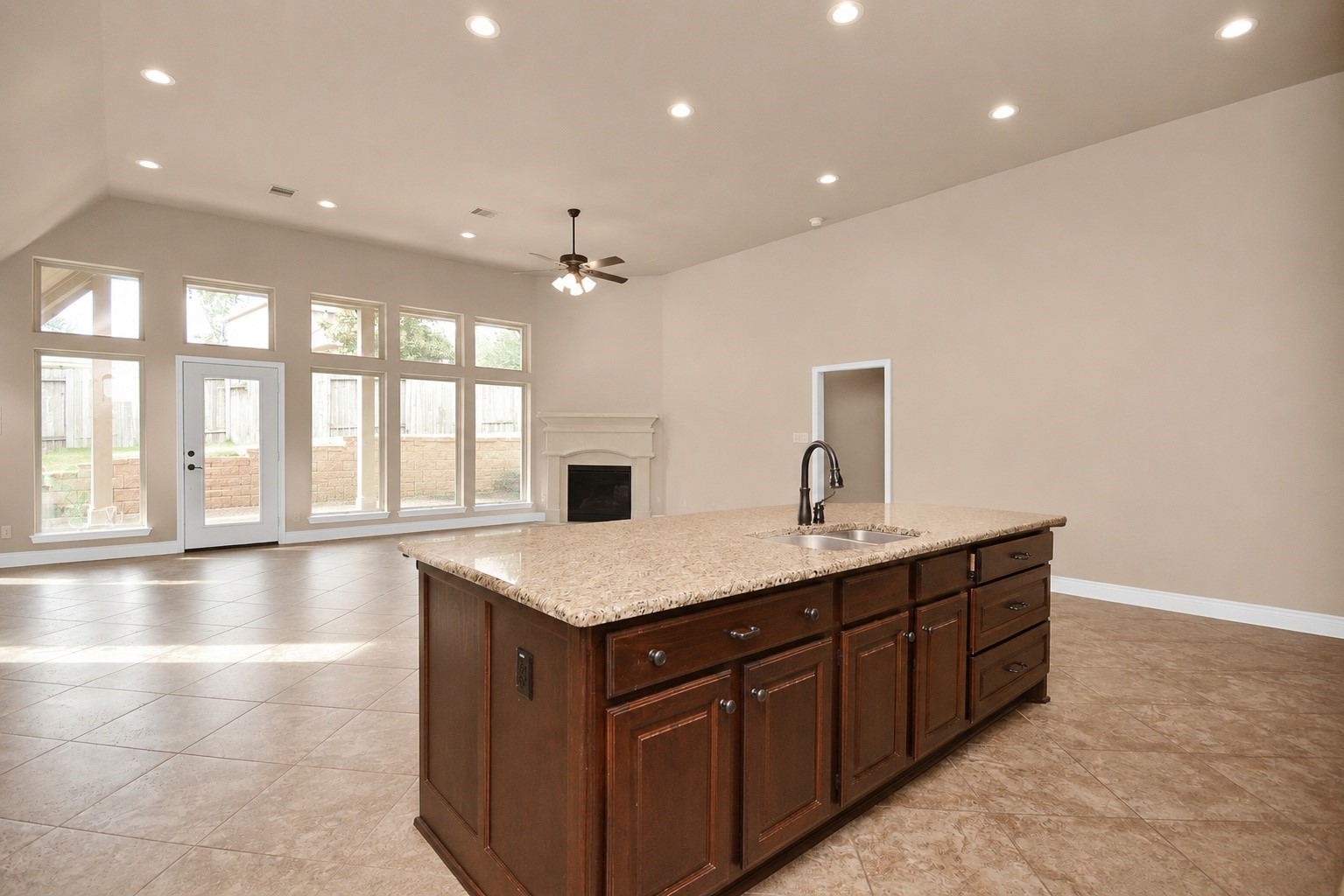 Kitchen facing the family & back covered patio