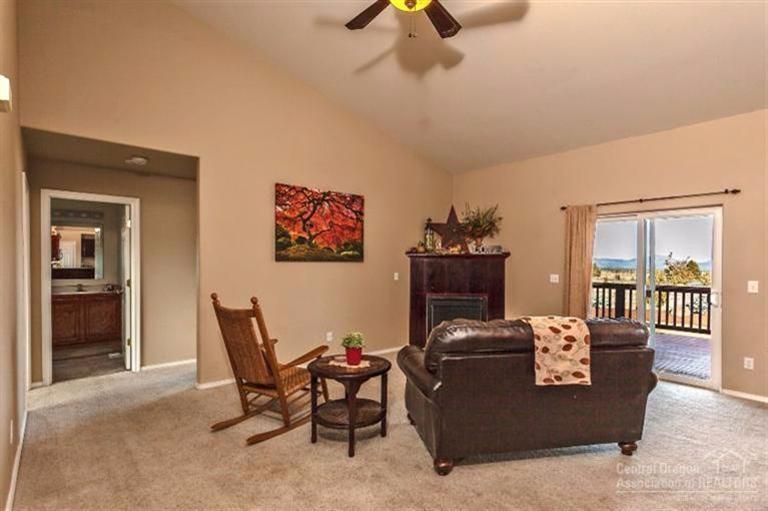 9552 Southwest Old West Road Powell Butte, OR 97753 - Photo 3 of 13 Living area off kitchen has slider to th