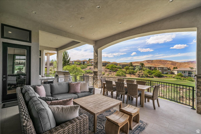 2608 Canyon Ridge Drive St. George, UT 84770 - Photo 46 of 86 Expansive covered patio featuring a built-in outdoor kitchen with stainless steel appliances, recessed lighting, and tile flooring