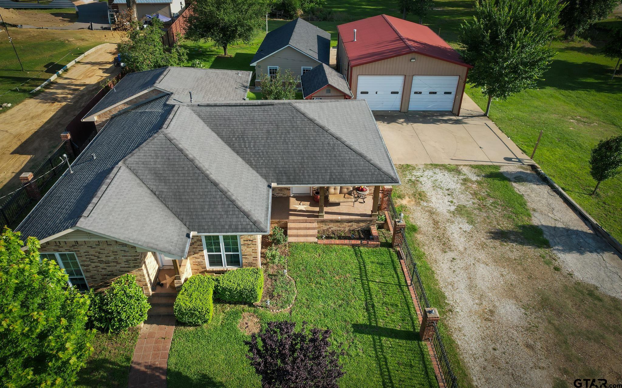11931 State Highway 64 Tyler, TX 75704 - Photo 1 of 44 an aerial view of a house with a garden