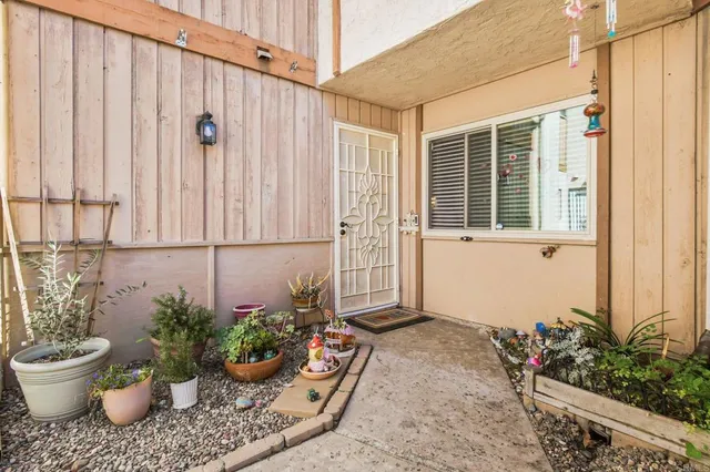 a view of a porch with potted plants