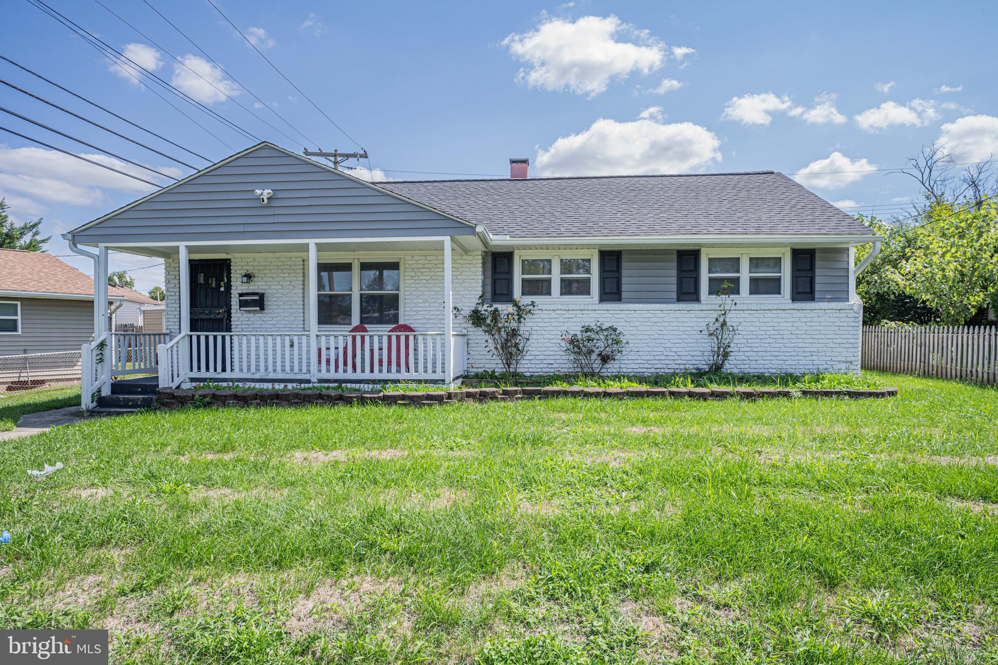 1002 8th Street Laurel, MD 20707 - Photo 1 of 19 a front view of a house with garden