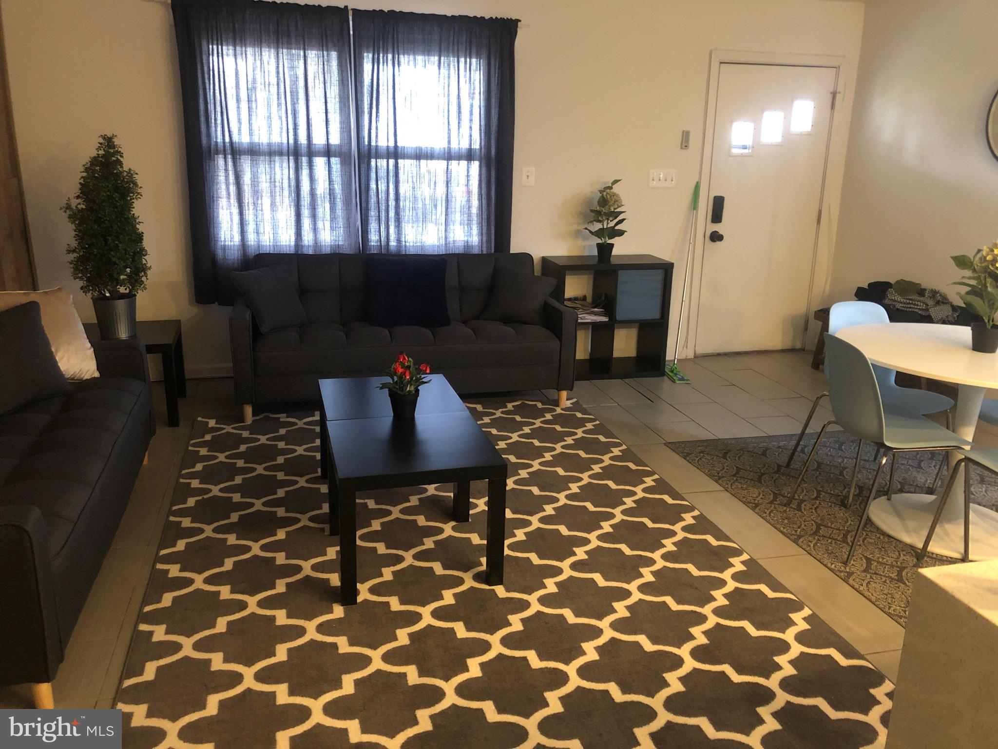 1002 8th Street Laurel, MD 20707 - Photo 12 of 19 a living room with furniture and a window