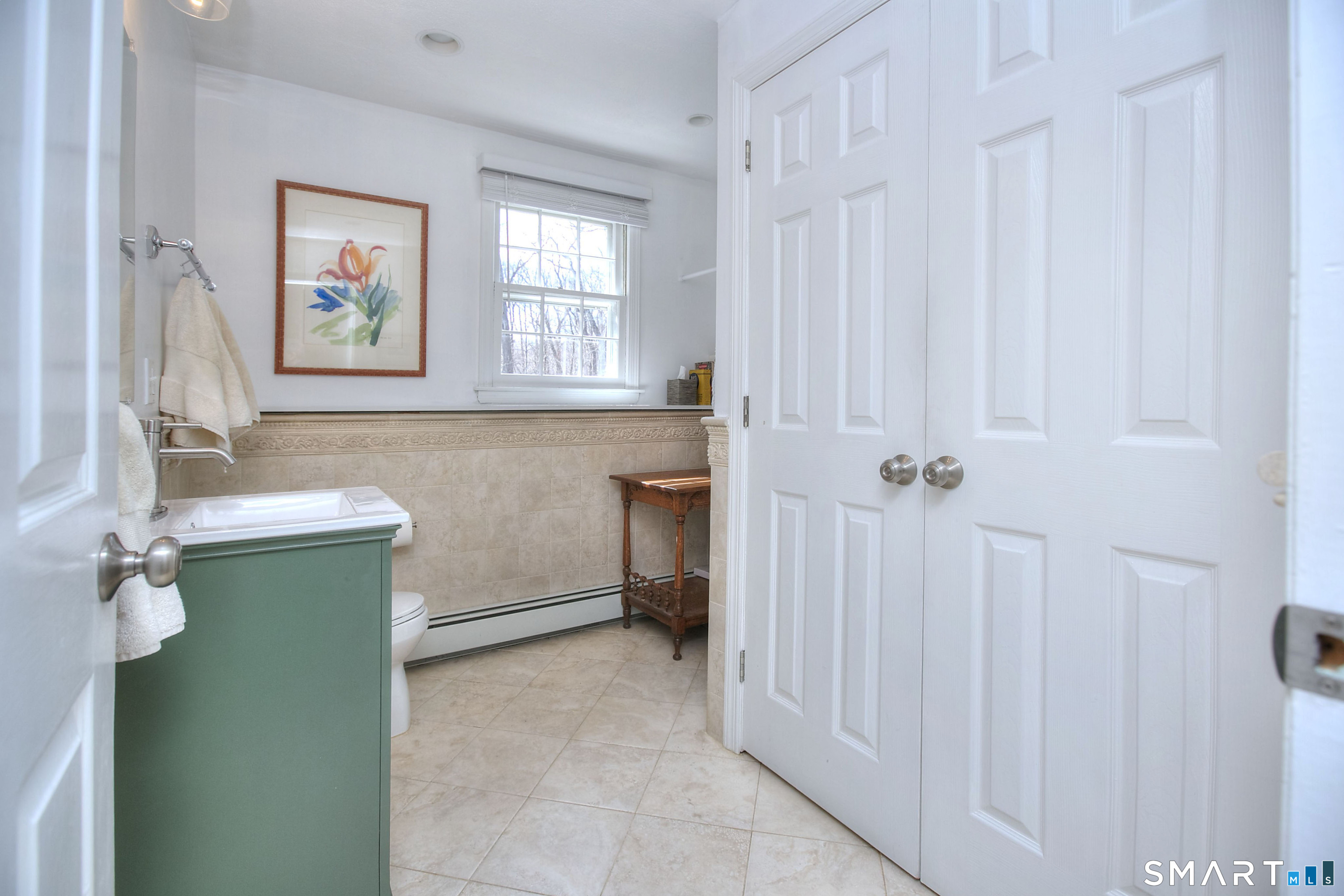 7 Richmond Hill Road Weston, CT 06883 - Photo 16 of 33 a bathroom with a sink and a window